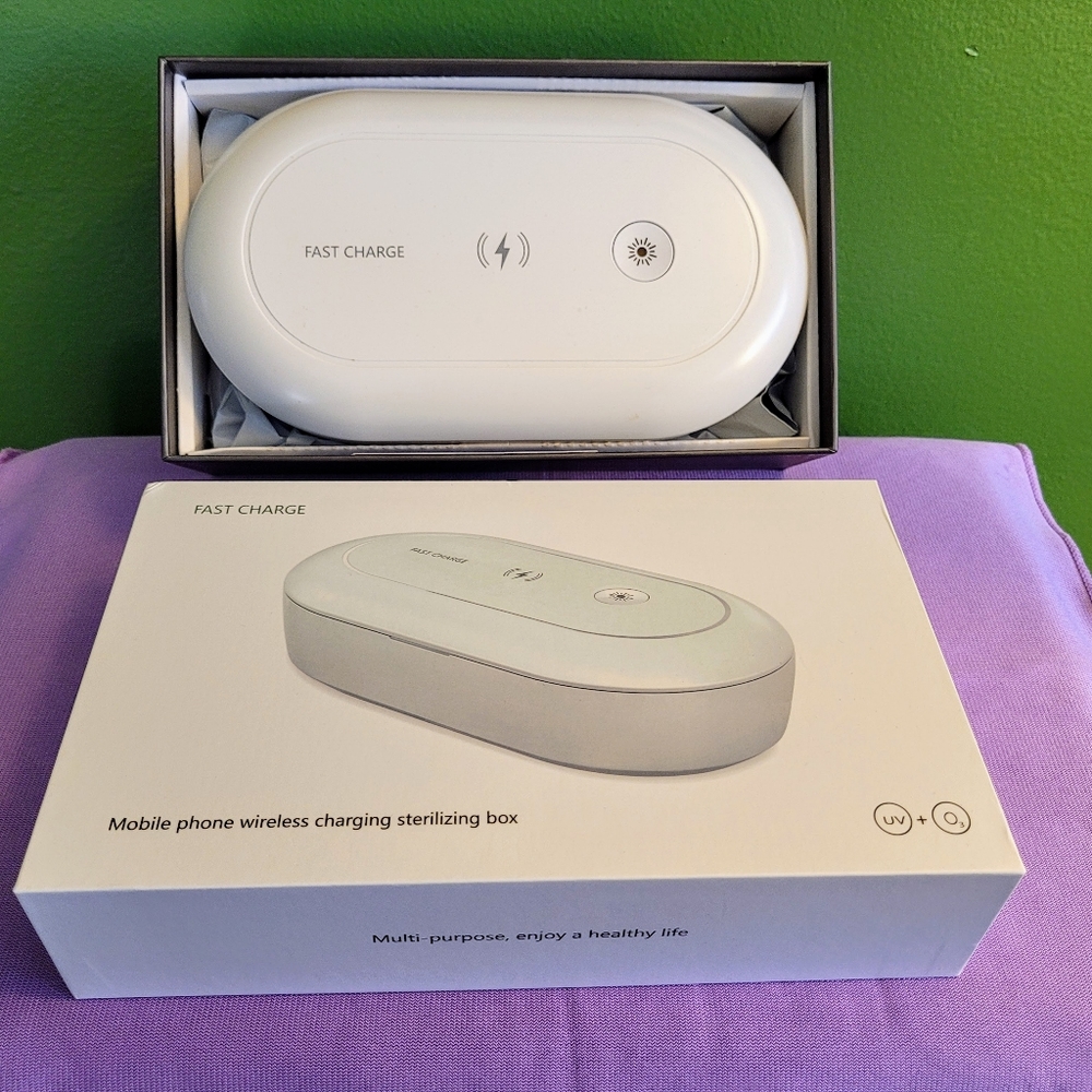 Mobile phone wireless charger and sanitizer